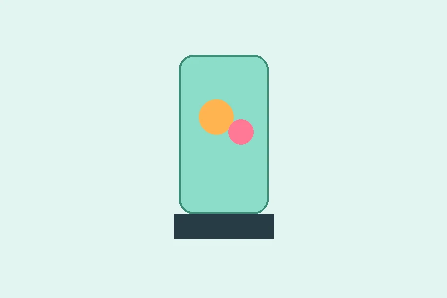 Cordless portable blender cup with fresh fruit on a kitchen counter